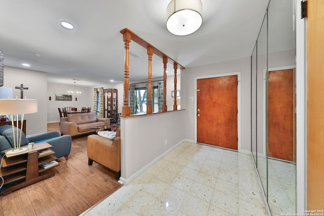 foyer with an inviting chandelier