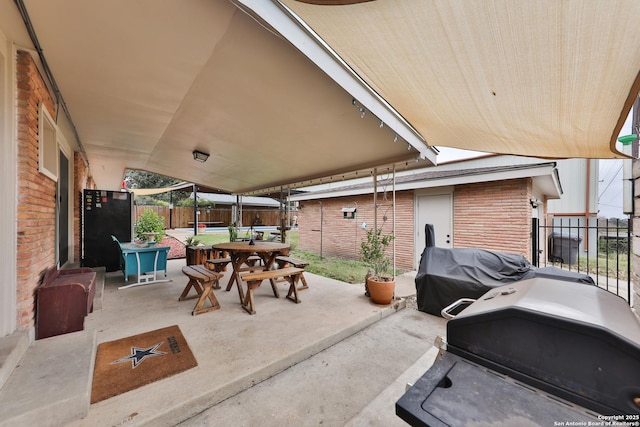 view of patio with a grill