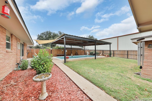 view of yard featuring a fenced in pool and a patio area