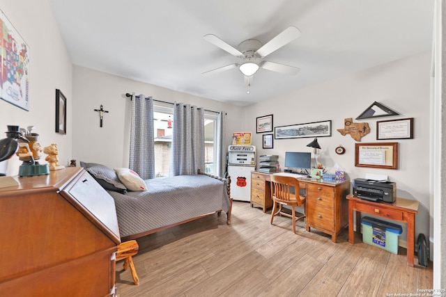 bedroom with light wood-type flooring and ceiling fan