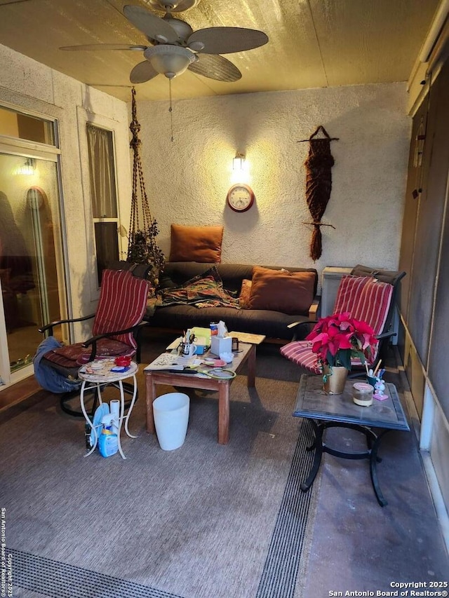 interior space featuring ceiling fan and an outdoor hangout area