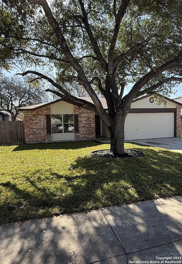 ranch-style home with a front lawn and a garage