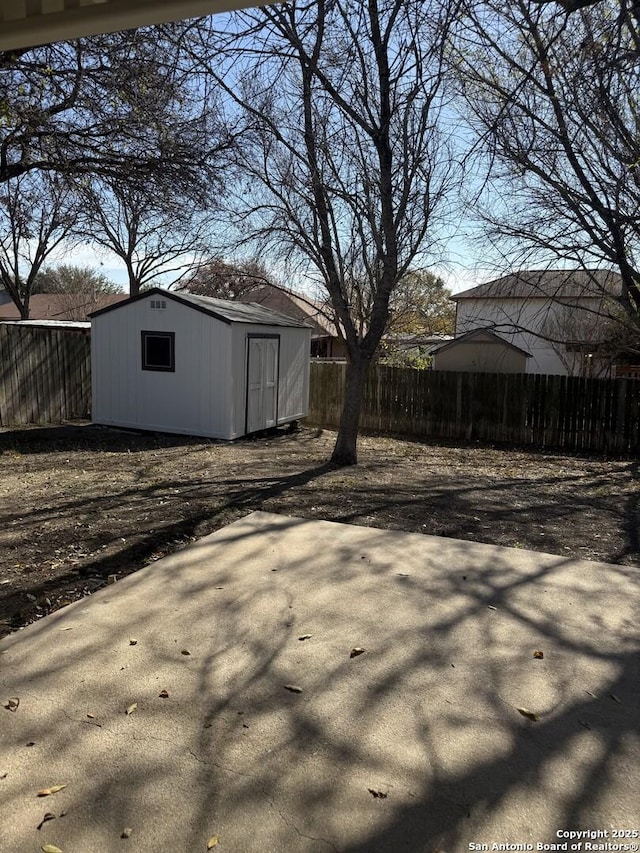 exterior space with a patio and a shed