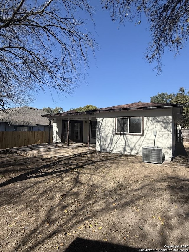 rear view of house featuring a patio area and central air condition unit