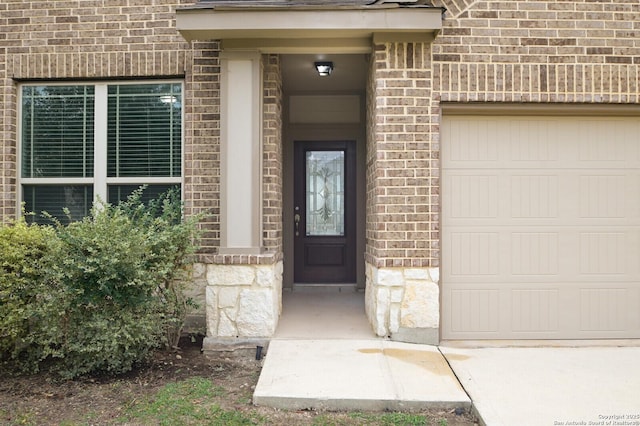 entrance to property featuring a garage