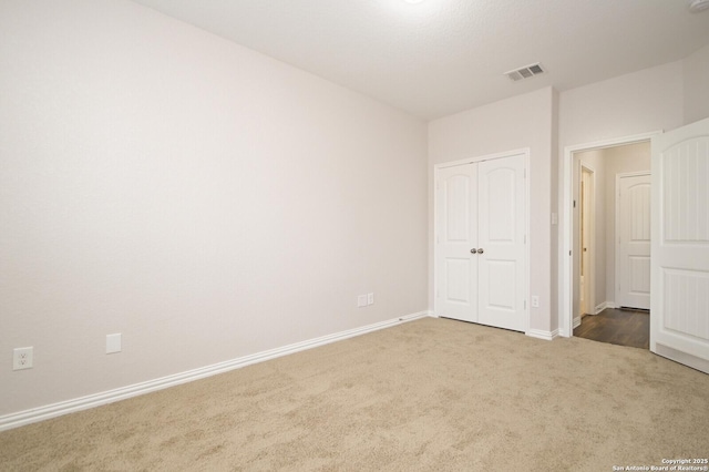 unfurnished bedroom with carpet floors