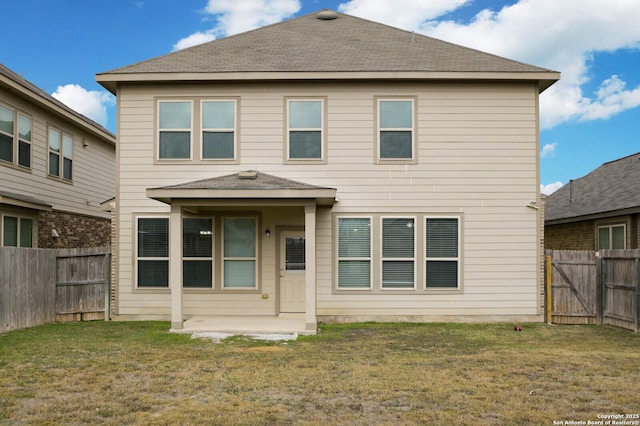 view of front of home with a patio area and a front yard