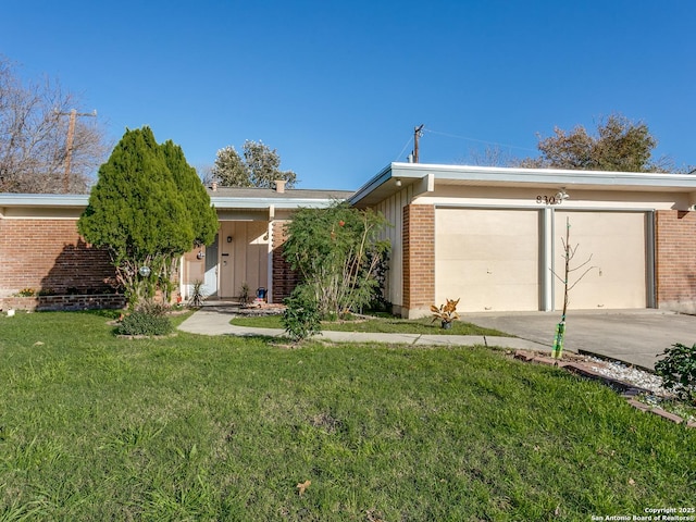 ranch-style house with a garage and a front yard