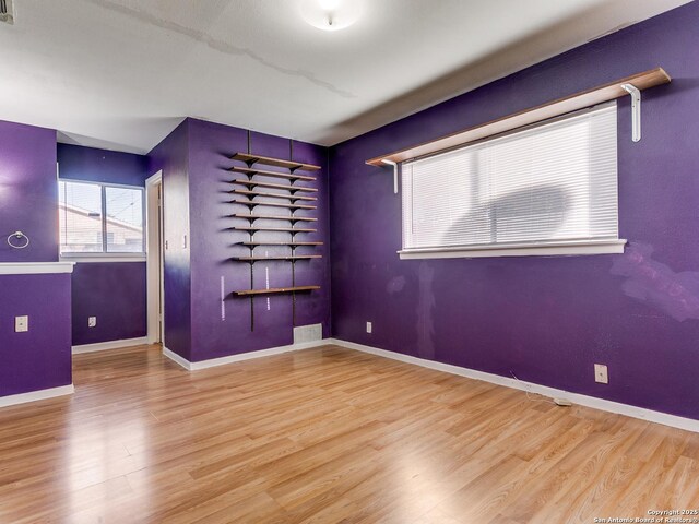 unfurnished room featuring wood-type flooring