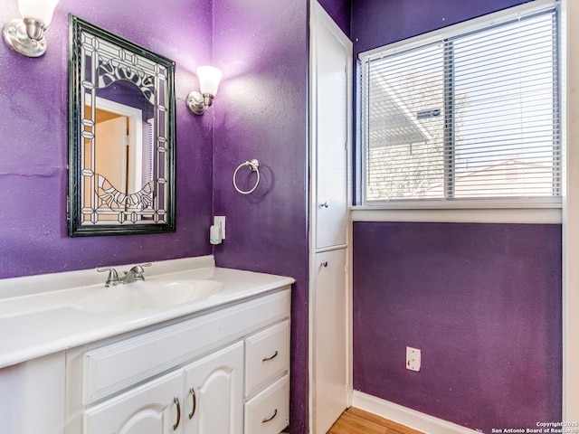 bathroom featuring vanity and wood-type flooring