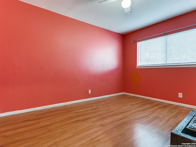 spare room with ceiling fan and light hardwood / wood-style flooring