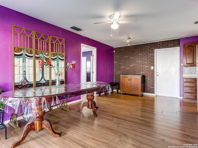 recreation room featuring ceiling fan and light hardwood / wood-style flooring