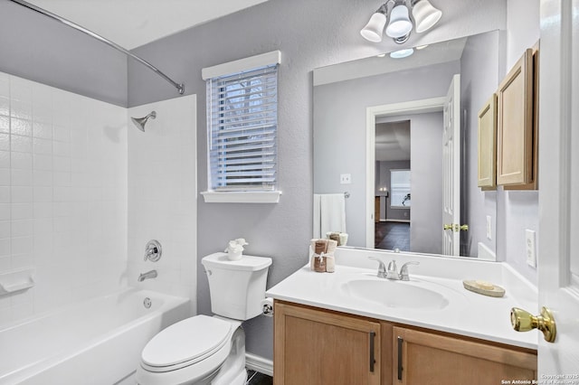 full bathroom featuring shower / bathing tub combination, vanity, and toilet