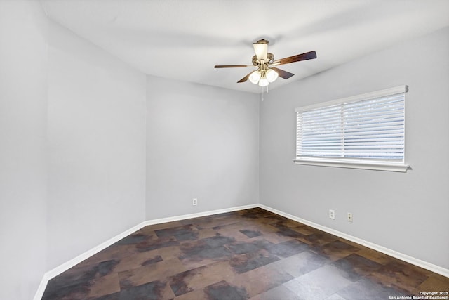 spare room with ceiling fan