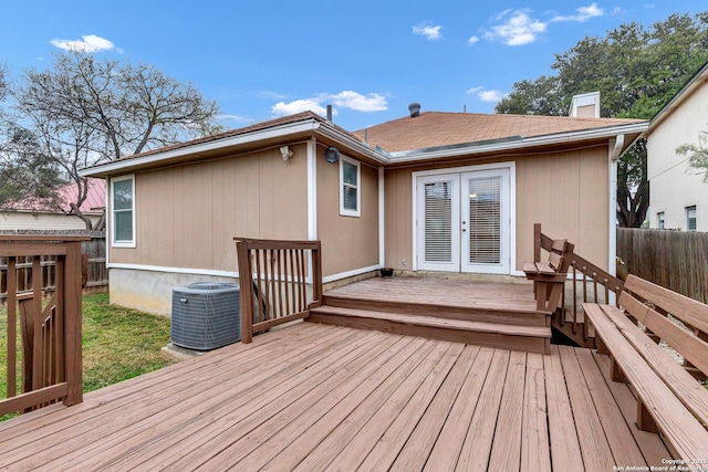 wooden terrace featuring french doors and central AC unit