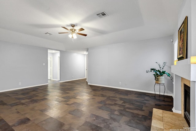 unfurnished living room with ceiling fan