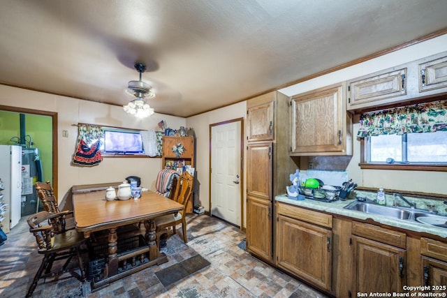 kitchen featuring water heater and sink