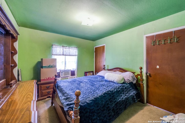 carpeted bedroom with a textured ceiling