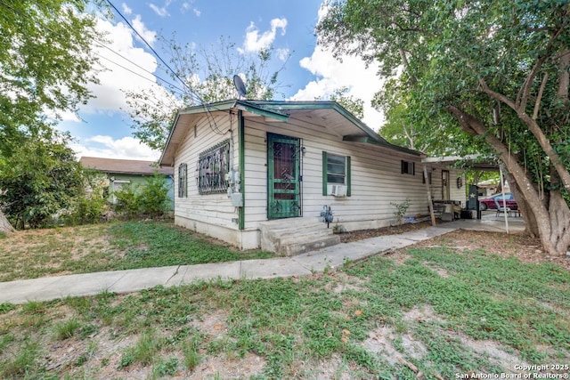 view of property exterior with a lawn