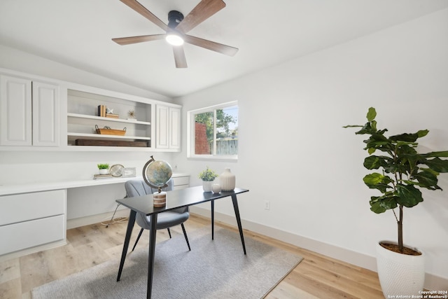 office space featuring ceiling fan, light hardwood / wood-style flooring, and lofted ceiling