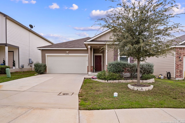 view of front of home featuring a garage and a front yard