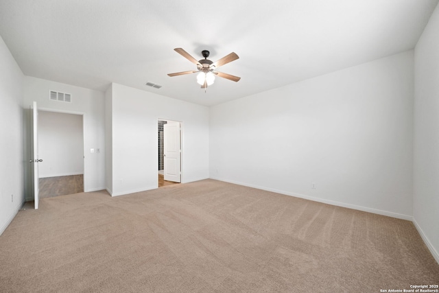 unfurnished bedroom with ceiling fan, light carpet, and a closet