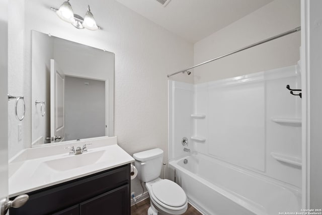 full bathroom featuring vanity,  shower combination, and toilet