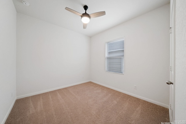 empty room with carpet flooring and ceiling fan