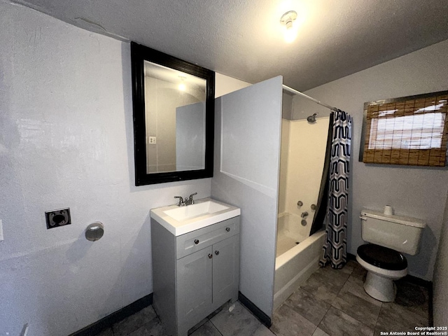 full bathroom with shower / bath combo, vanity, a textured ceiling, and toilet