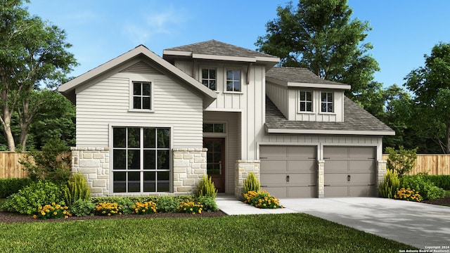 view of front of property featuring a garage and a front lawn