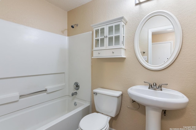 bathroom with toilet and shower / washtub combination