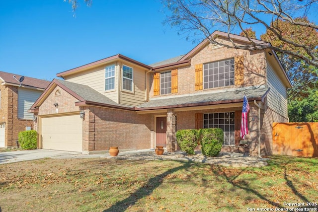 view of front facade with a front yard and a garage