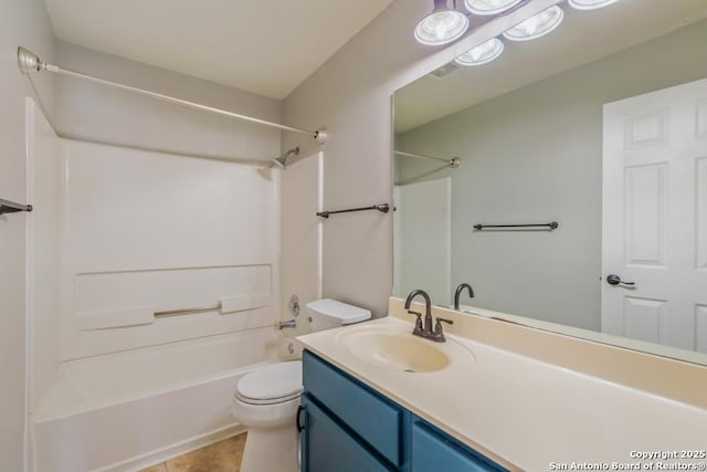 full bathroom featuring tile patterned floors, vanity, bathtub / shower combination, and toilet