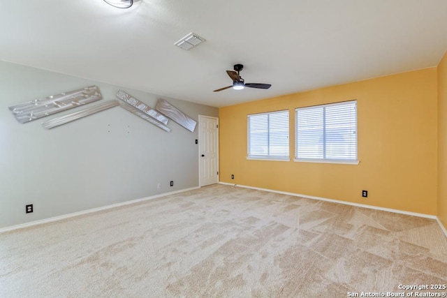 carpeted empty room with ceiling fan