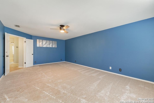 unfurnished room with light carpet and ceiling fan