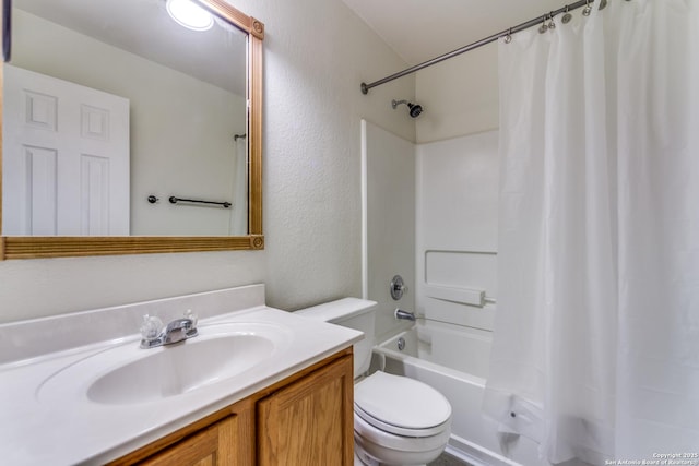 full bathroom featuring vanity, shower / bath combo, and toilet