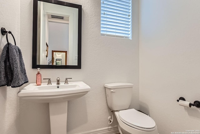 bathroom with toilet and sink