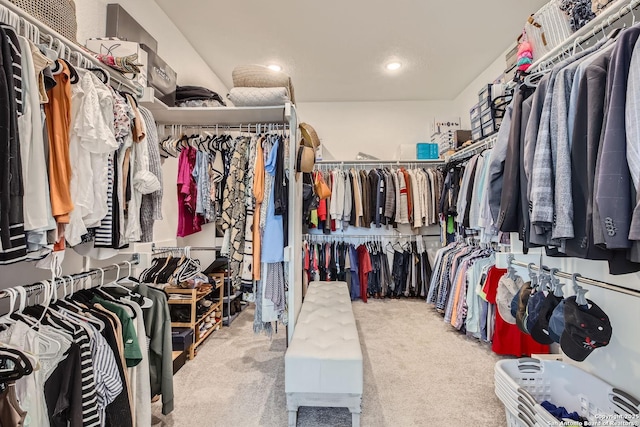 spacious closet with carpet flooring