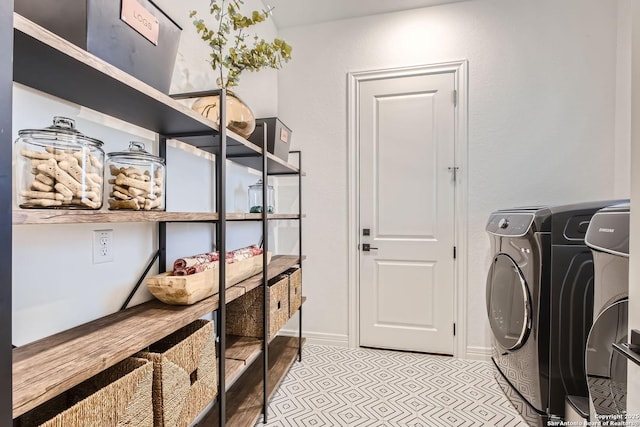 laundry room with washing machine and dryer