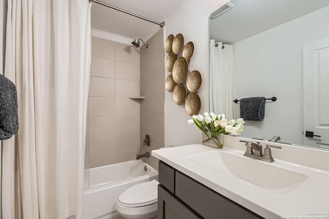 full bathroom with vanity, shower / bathtub combination with curtain, and toilet