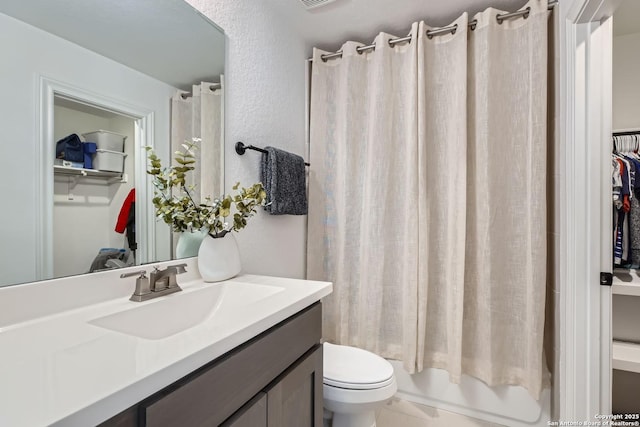 full bathroom with vanity, toilet, and shower / tub combo with curtain