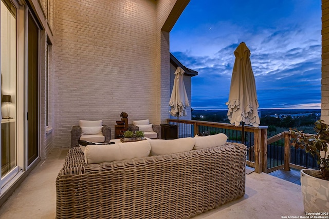 patio terrace at dusk with an outdoor living space