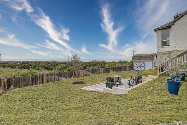 view of yard featuring a patio area and a storage shed