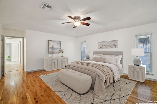 bedroom featuring light wood-type flooring and ceiling fan