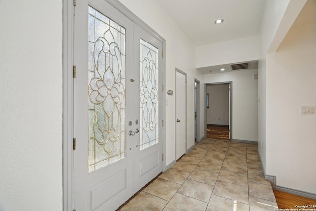 foyer with light tile patterned floors