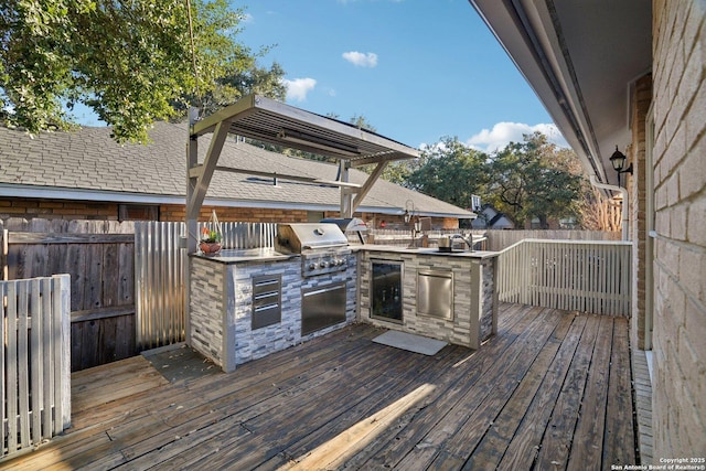 wooden deck featuring area for grilling and grilling area