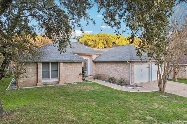 single story home featuring a garage and a front yard