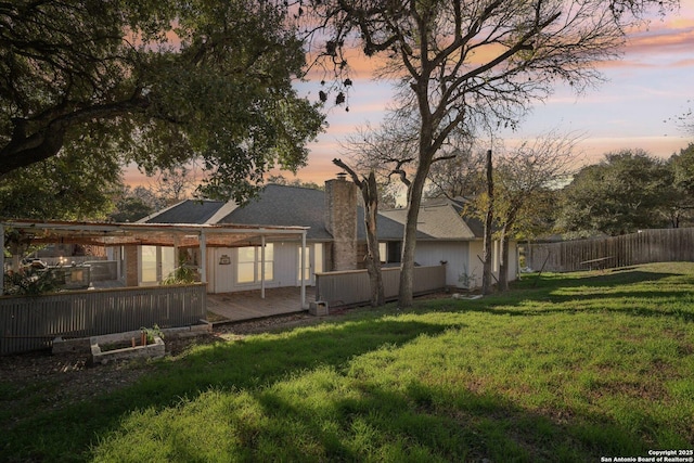 exterior space with a yard and a deck