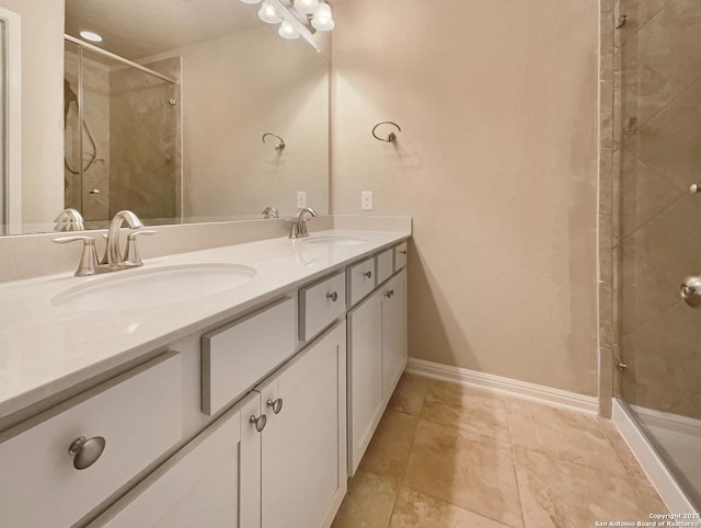 bathroom with tile patterned flooring, vanity, and an enclosed shower