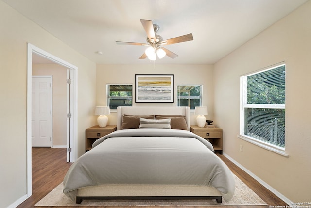 bedroom with hardwood / wood-style flooring and ceiling fan